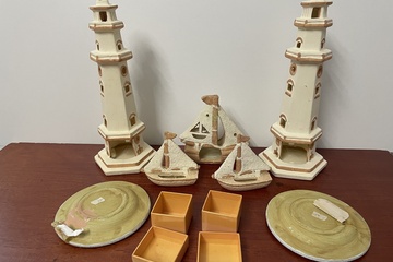 Afbeelding van Vuurtoren met boten en borden