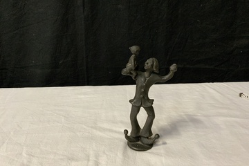Afbeelding van Bronzen Clown met Kind van Corry Ammerlaan
