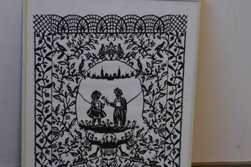 Afbeelding van Knipkunst. Knipwerk van een jongen en meisje.